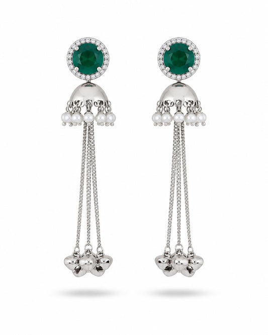 Silver jhumka tassel earrings with emerald green CZ halo top, pearl drops and long chain tassels with floral cluster ends — pair on white background